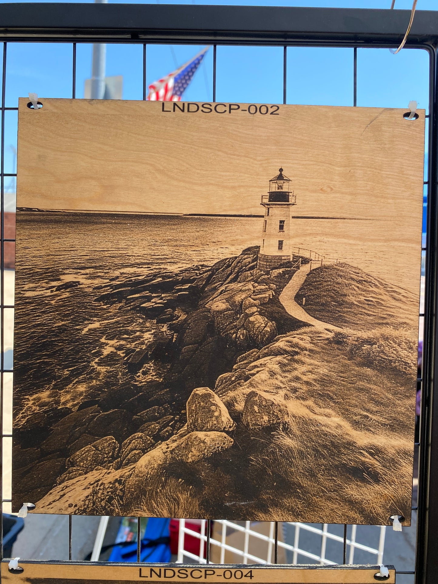 "Lighthouse Watch – Guiding Light on Rugged Shores" SKU: LNDSCP-002